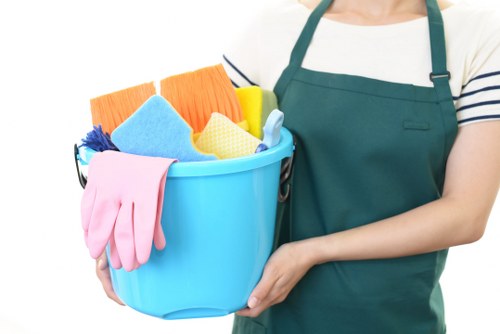 Staff member following safe carpet cleaning practices on site