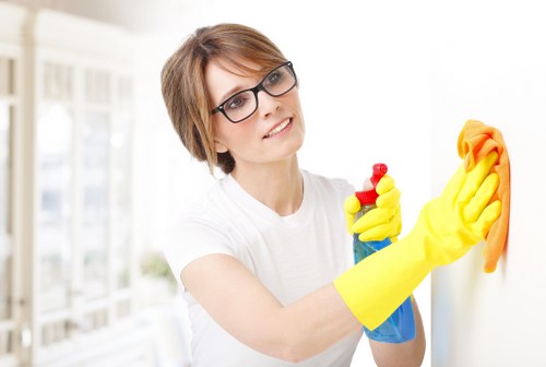 Local cleaner preparing a short-let property for new guests in Edgware